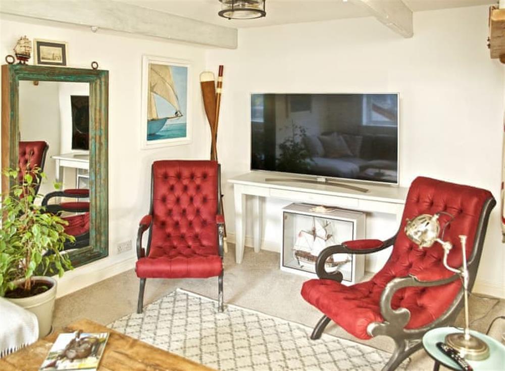 The elegant living room has a Smart TV at The Salt Loft in Fowey, Cornwall