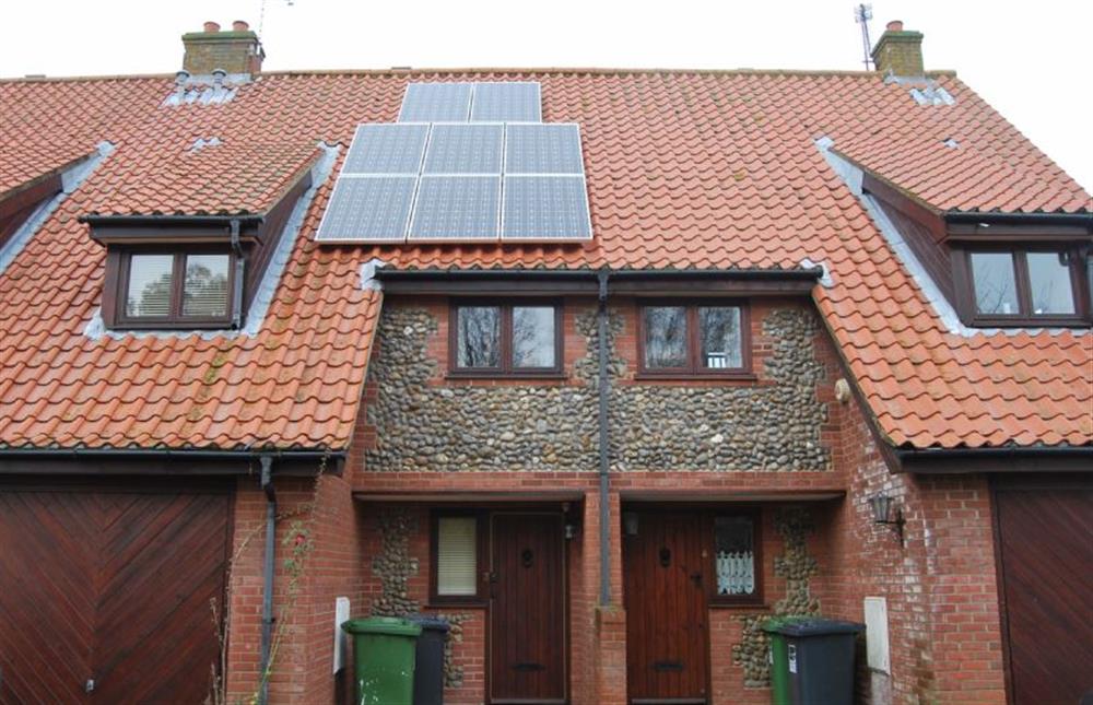 The Saltings: Front elevation with solar panels at The Saltings Blakeney, Blakeney near Holt