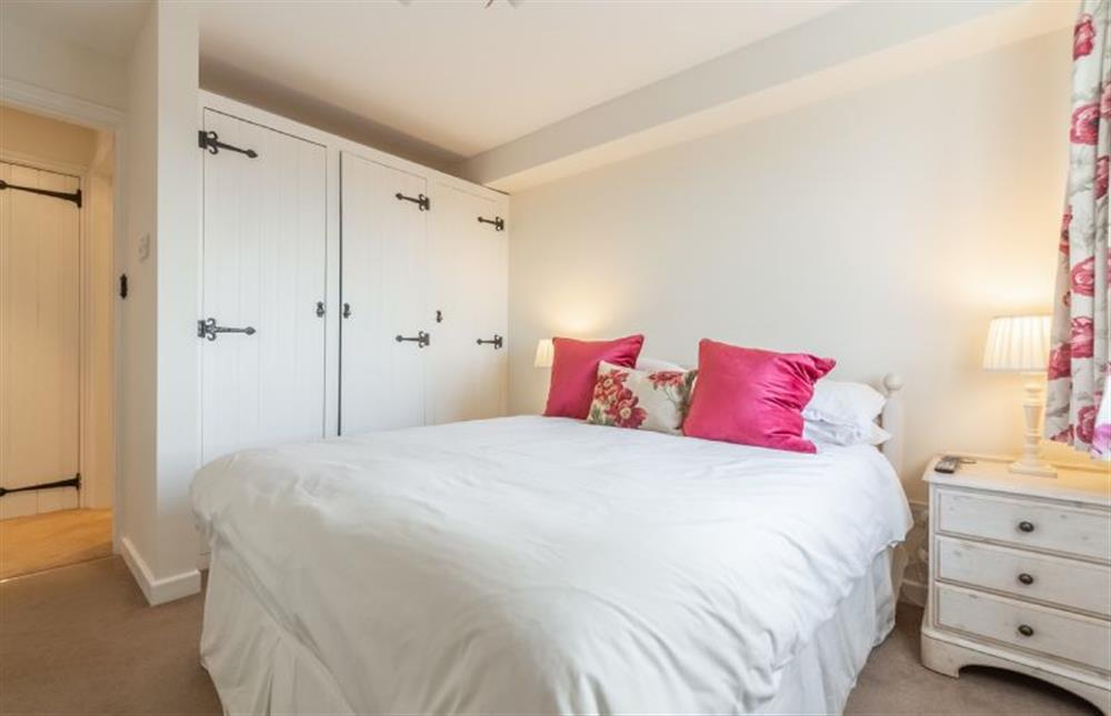 Upper Ground Floor: Master bedroom with built-in wardrobe at The Saltings Blakeney, Blakeney near Holt