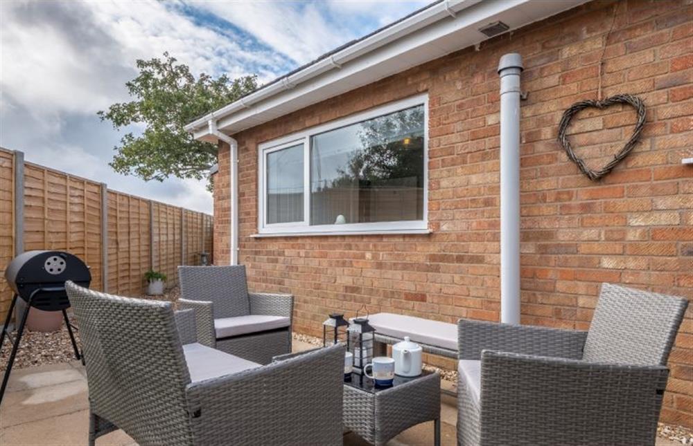 Enjoy a coffee or a barbecue in the sheltered garden at The Saltings, Heacham near Kings Lynn