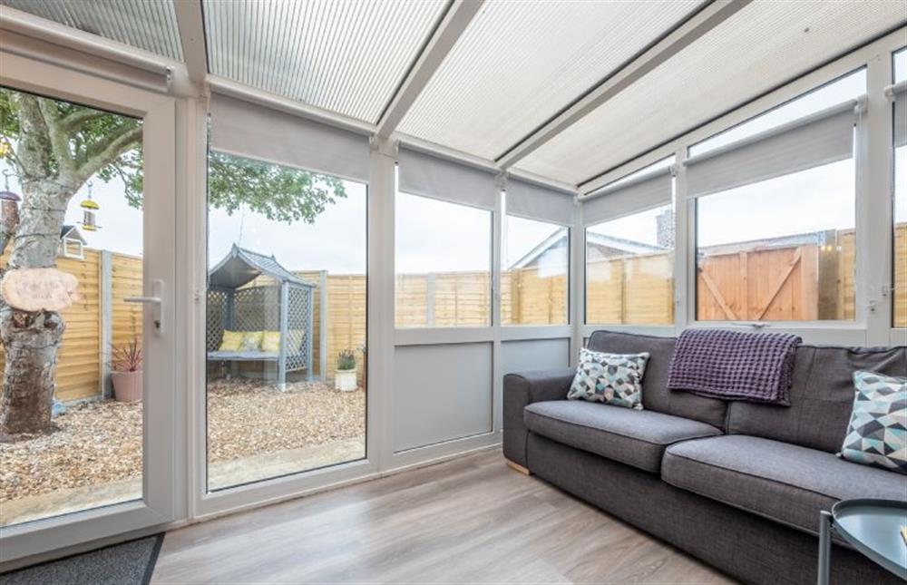 Ground floor: The large conservatory is a peaceful place to relax at The Saltings, Heacham near Kings Lynn