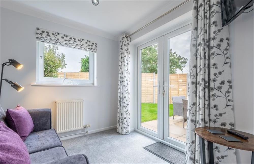 Ground floor: The sun room offers the additional option of a sofa-bed at The Saltings, Heacham near Kings Lynn