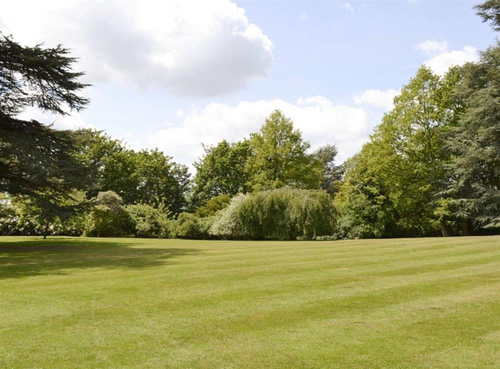 Beautiful lawned gardens within the 4 acre grounds at The Sanctuary in Little Chart, near Ashford, Kent