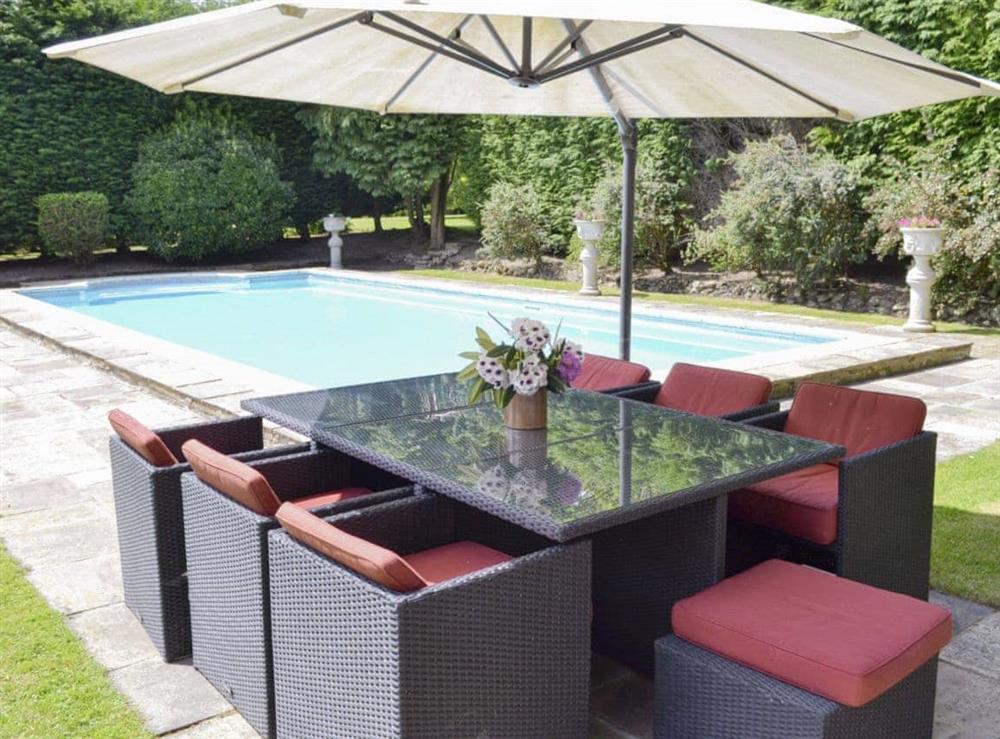 Convenient poolside seating area at The Sanctuary in Little Chart, near Ashford, Kent