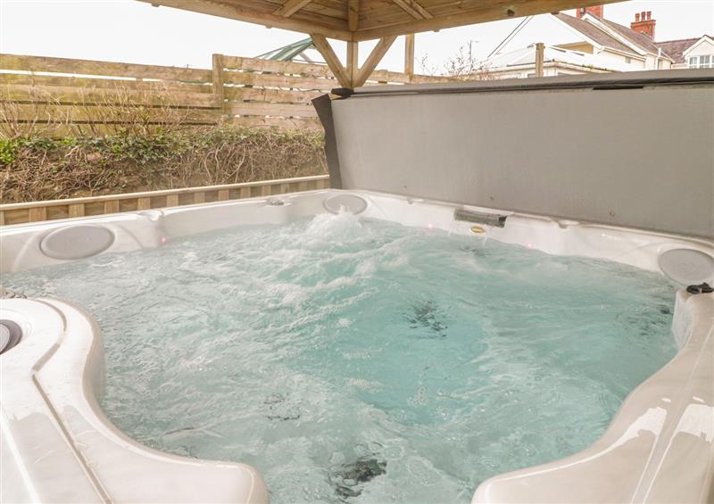 Enjoy the hot tub (photo 2) at The Sandy Bee, Benllech