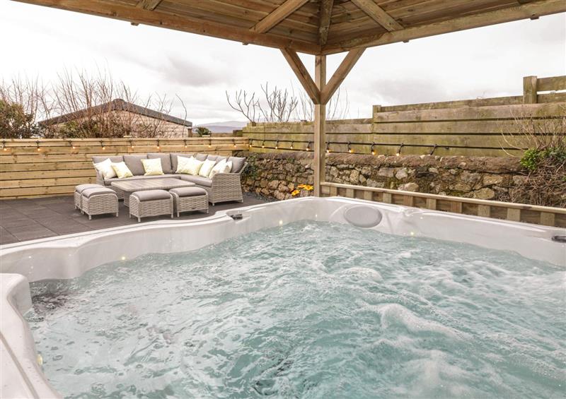 Enjoy the hot tub at The Sandy Bee, Benllech