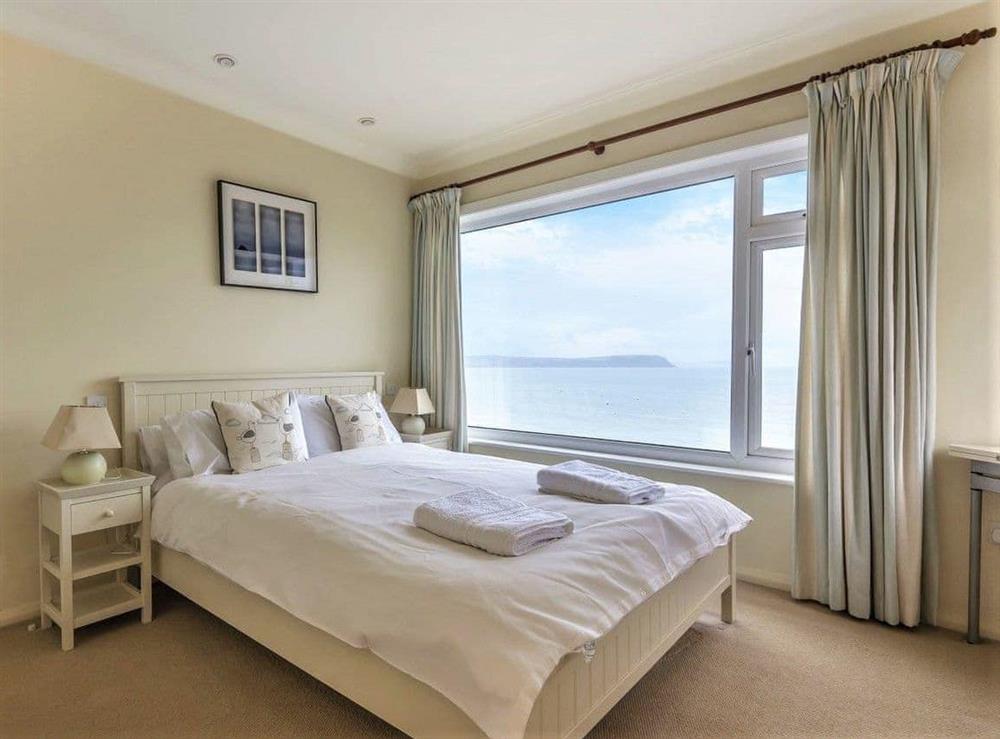 Master bedroom with a sea view at The Sea House in Portscatho, Cornwall