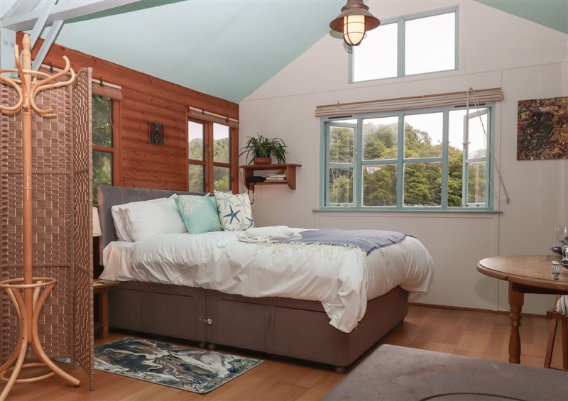 A bedroom in The Sharpham Boat House at The Sharpham Boat House, Ashprington