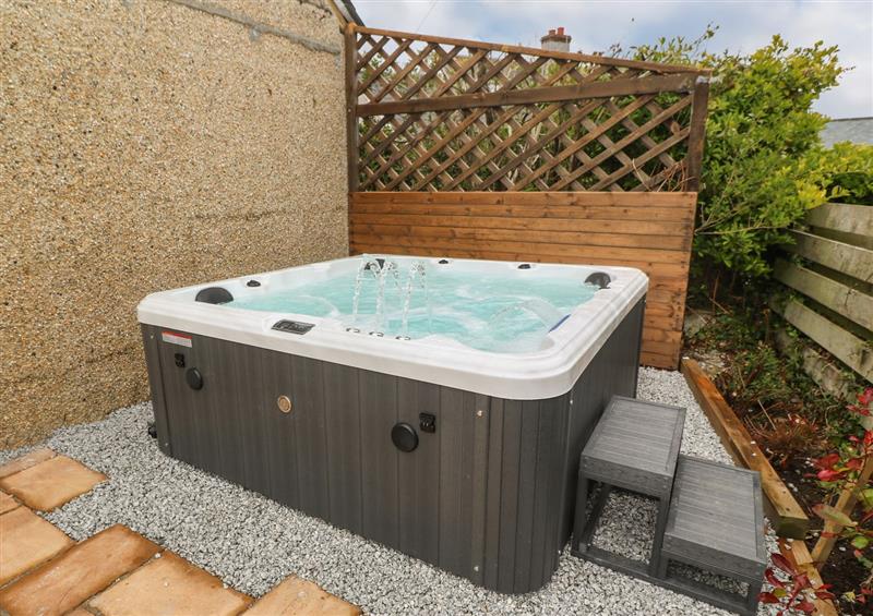 Relax in the hot tub at The Shed, Mullion