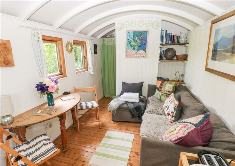 Enjoy the living room at The Shepherd Hut, Nine Wells near Solva