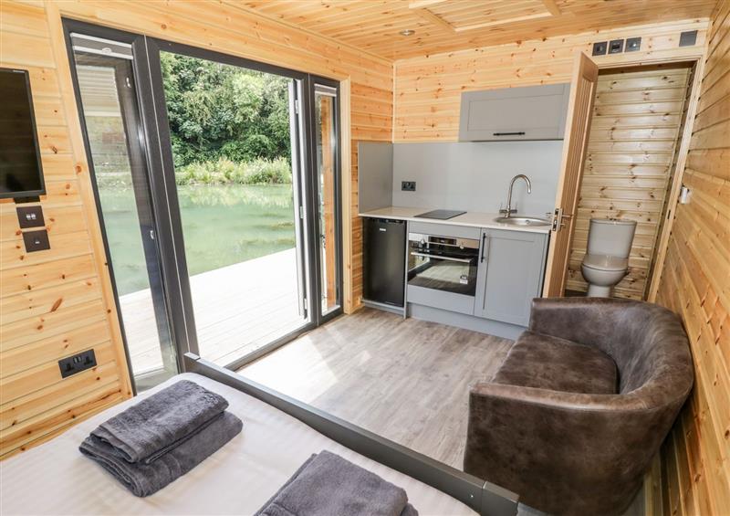 Relax in the living area at The Shepherds Hut at Bridge Lake Farm & Fishery, Chacombe