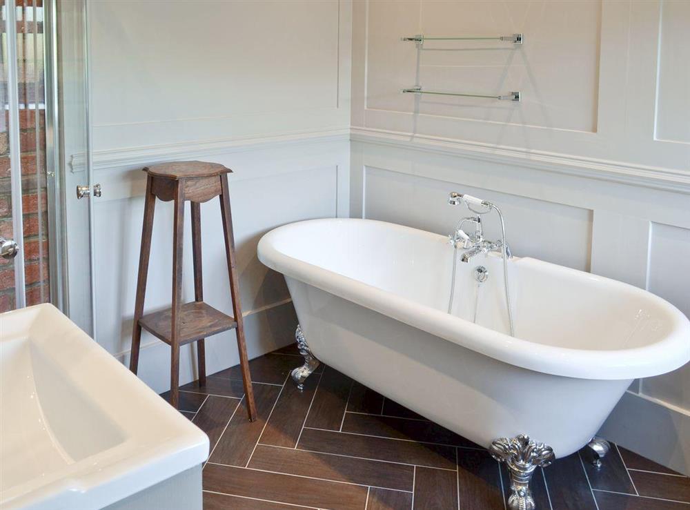 Impressive bathroom with roll-top bath at The Shillings in Alnwick, Northumberland