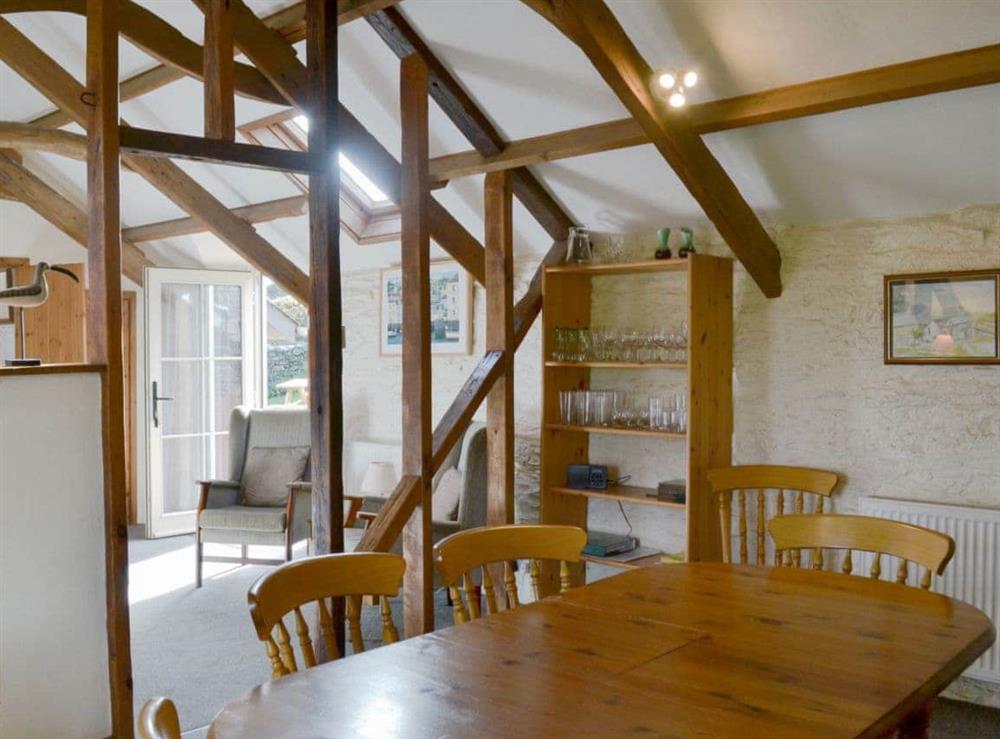 Dining Area with wooden beams at The Shippen in East Prawle, South Devon., Great Britain