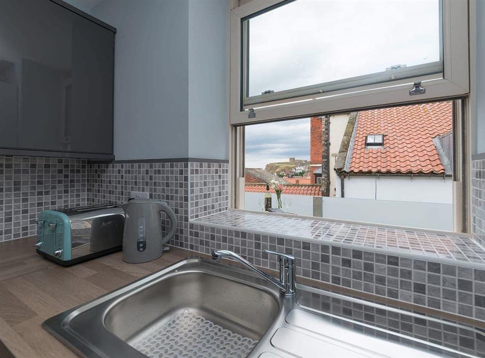 Charming kitchen with access to the balcony at The Shipping Office in Whitby, Yorkshire, North Yorkshire