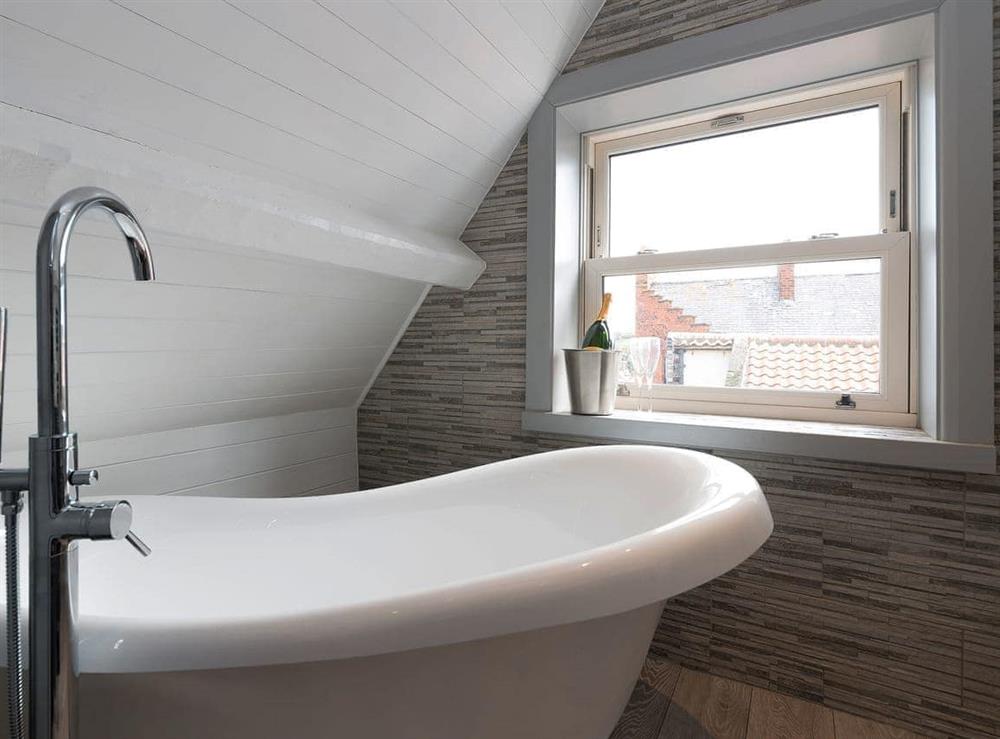 En-suite bathroom with contemporary slipper bath at The Shipping Office in Whitby, Yorkshire, North Yorkshire