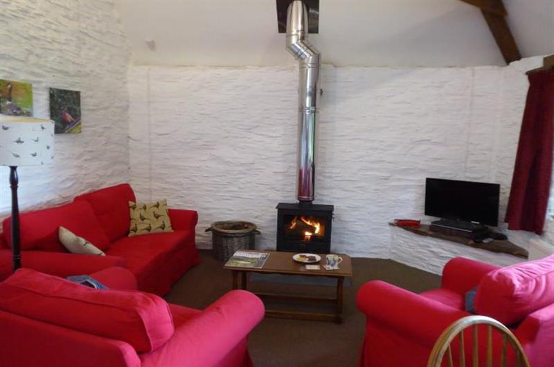 Living room with its wood burning stove at The Shippon, Wheddon Cross