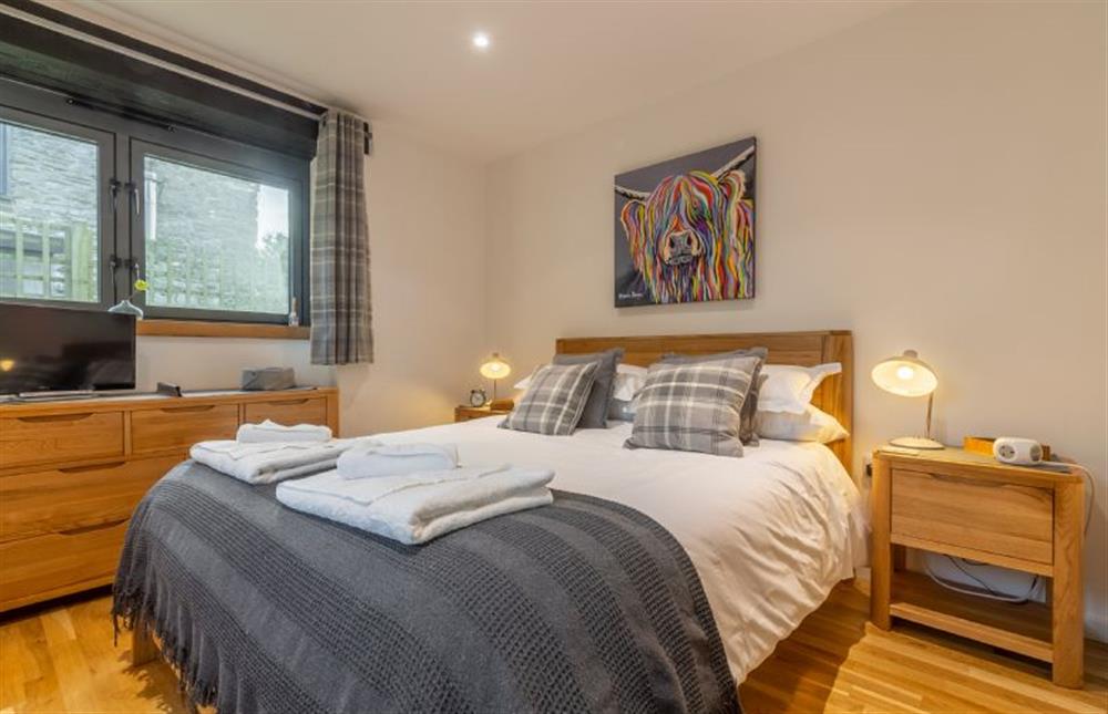 Bedroom one with king-size bed, smart television and en-suite at The Shires, St Agnes 