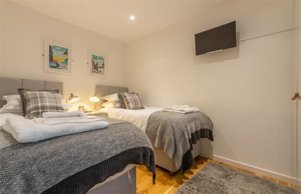 Bedroom two with twin beds and a smart television at The Shires, St Agnes 