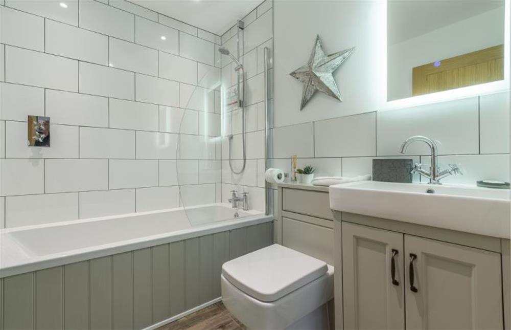 Family bathroom with shower over bath, wash basin and WC at The Shires, St Agnes 