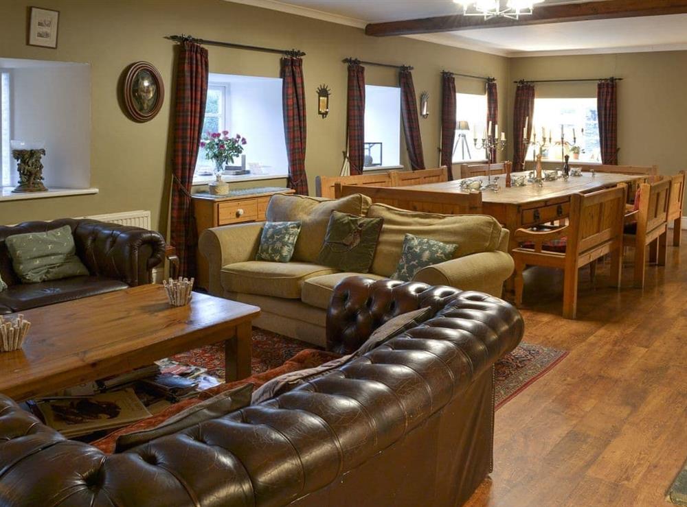 Living room and dining area at The Shooting Lodge in Colquite, Washaway, North Cornwall., Great Britain