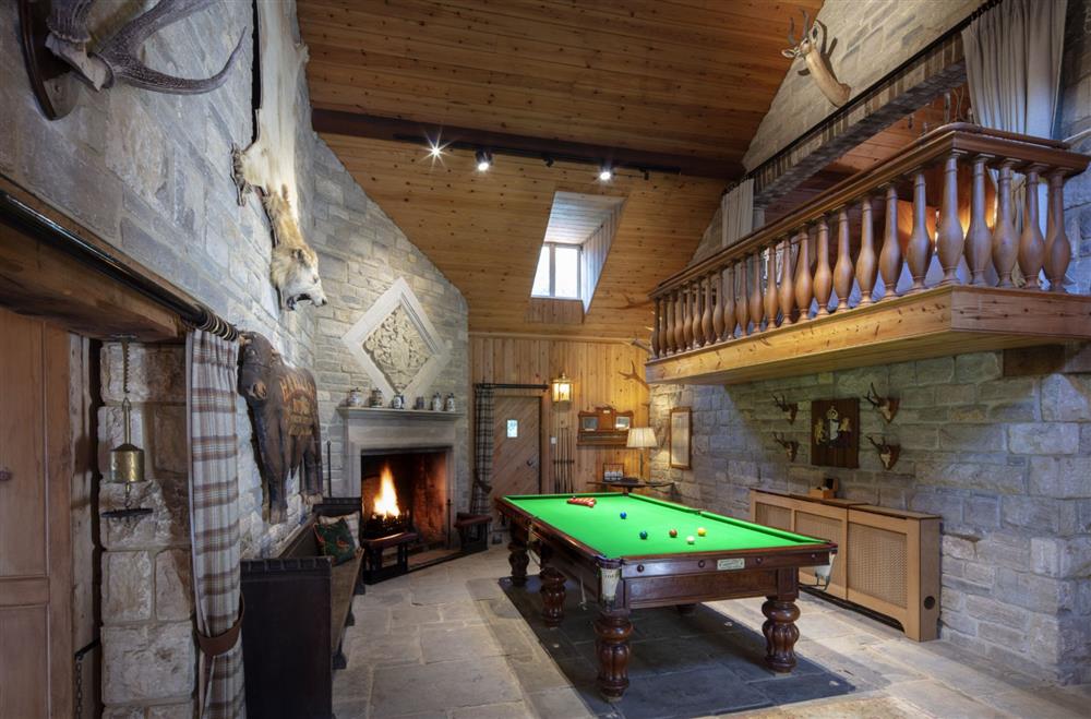 The Billiard Room with open fire at The Shooting Lodge, Dorset