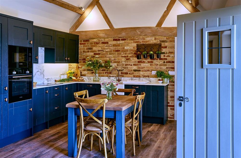 The elegant kitchen and dining area  at The Shooting Lodge, Walton, Near Stratford-upon-Avon