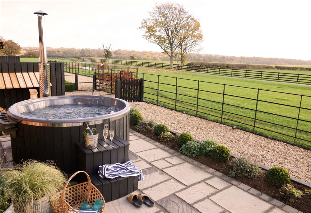 While away the day in the wood-fired hot tub at The Shooting Lodge, Walton, Near Stratford-upon-Avon