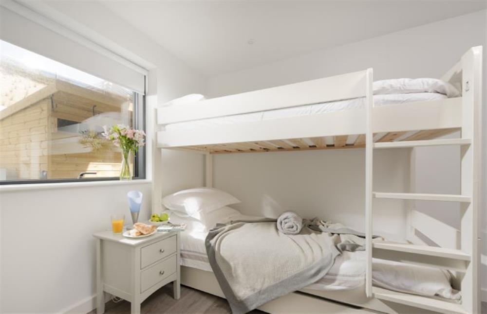Bedroom three on the ground floor with single bunk beds (suitable for children only) at The Shore, Mawgan Porth