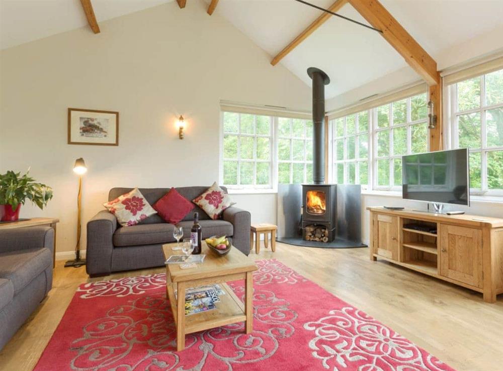 Comfortable living area with wood burner at The Signal Box in Loddiswell Station, near Kingsbridge, Devon, England