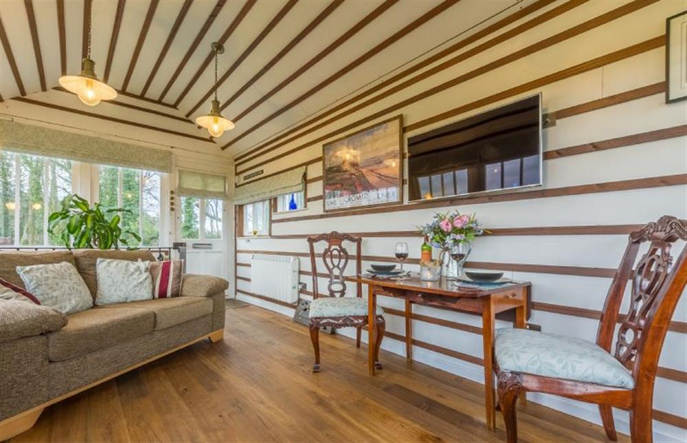 First floor:  Open-plan living space with comfy sofa and flatscreen television at The Signal Box, Melton Constable