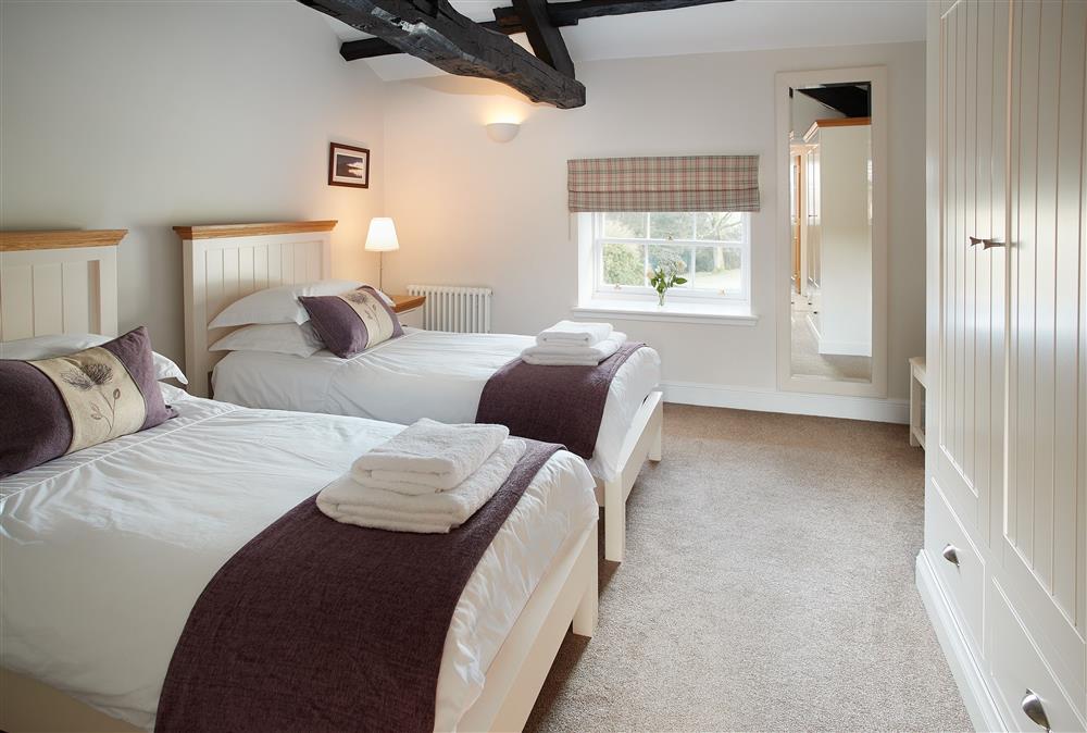 Bedroom with twin 3’ single beds (photo 2) at The Sir Walter Scott Apartment, Netherby Hall, Longtown