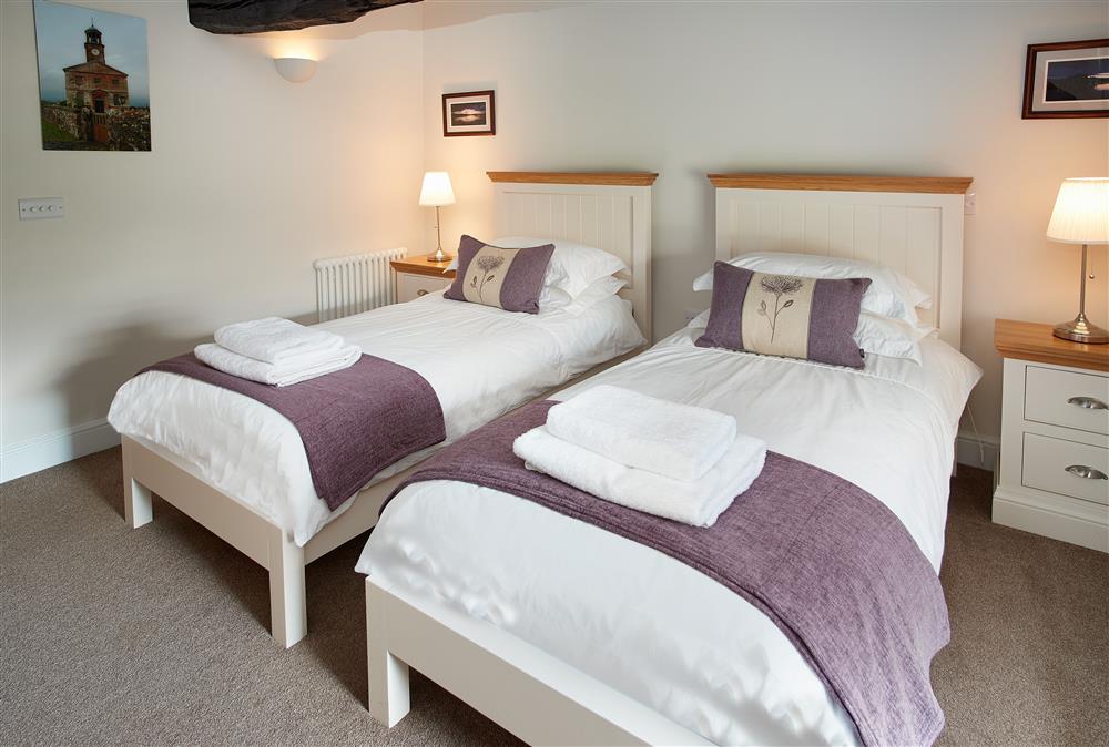 Bedroom with twin 3’ single beds at The Sir Walter Scott Apartment, Netherby Hall, Longtown