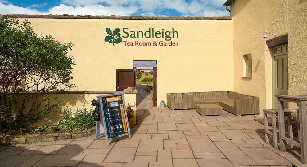 The shared courtyard with Sandleigh Tea Room & Gardens, Croyde, Devon at The Slipway in Croyde, North Devon