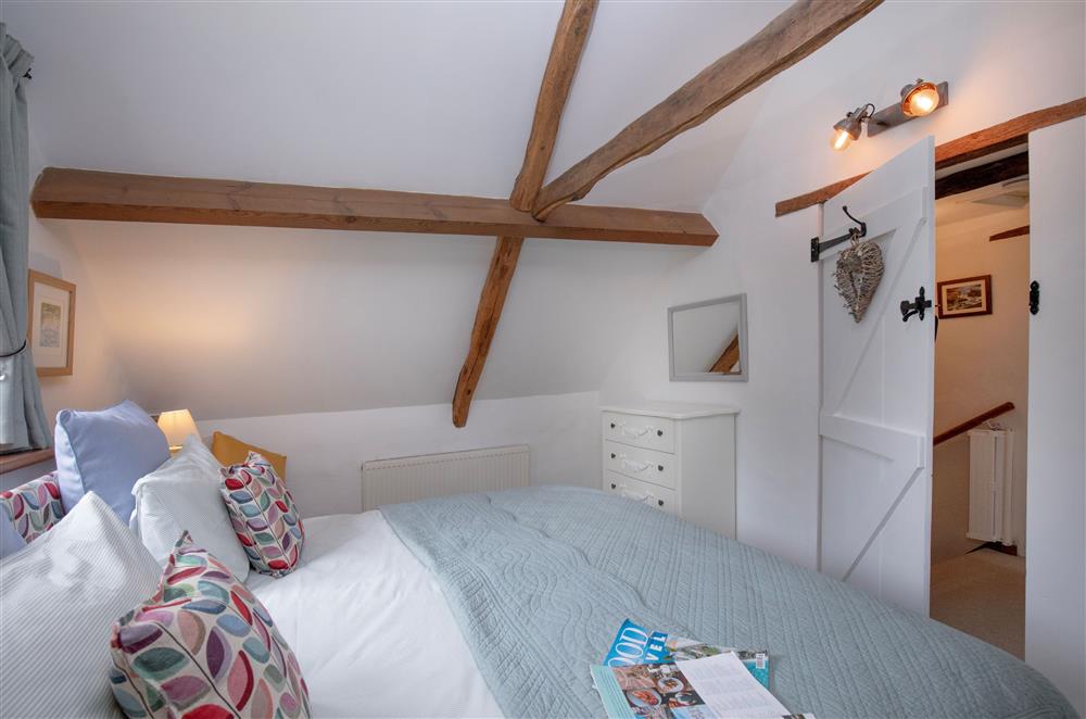 Original wooden beams continue through the first floor of this charming property