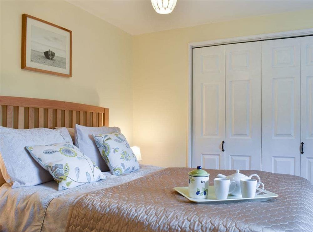 Main bedroom with kingsize bed at The Smithy in Bodsham, Nr Canterbury., Kent