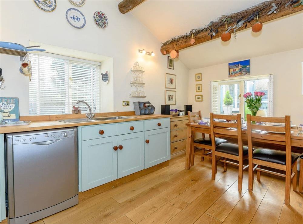 Fully equipped kitchen with dining area at The Smithy in Brassington, Nr. Matlock, Derbyshire