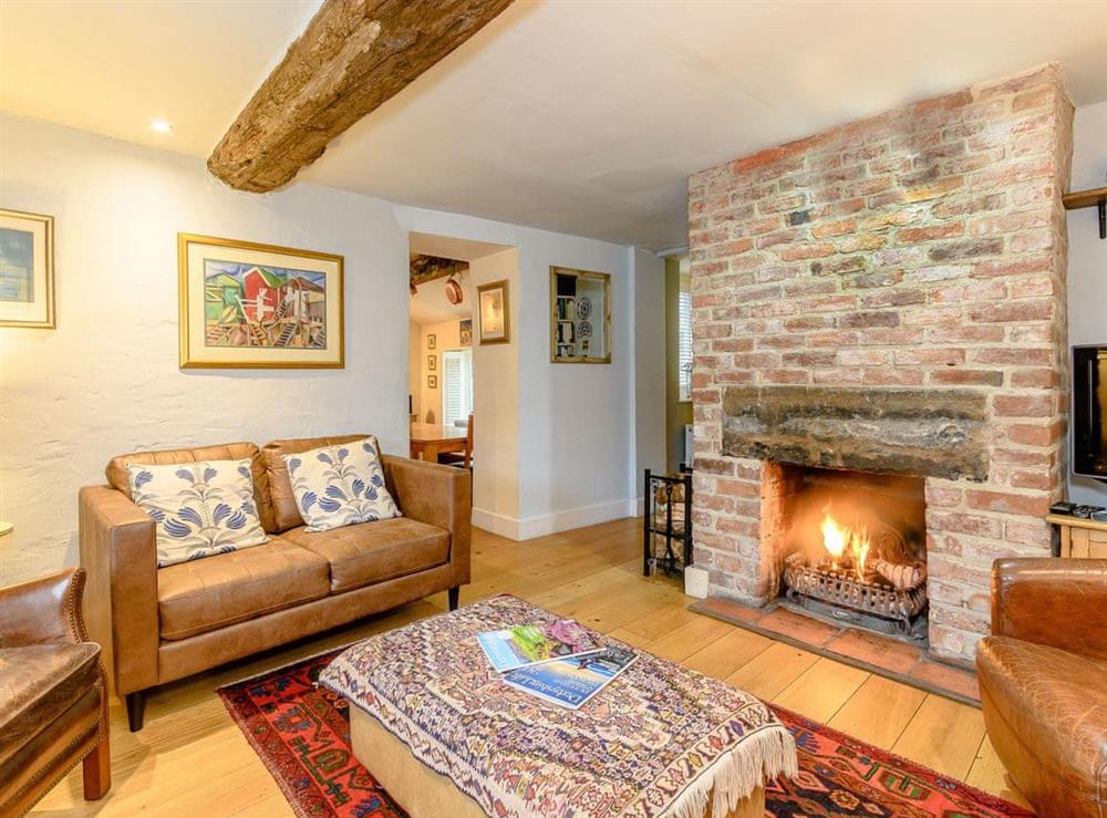 Welcoming living room with open fire at The Smithy in Brassington, Nr. Matlock, Derbyshire