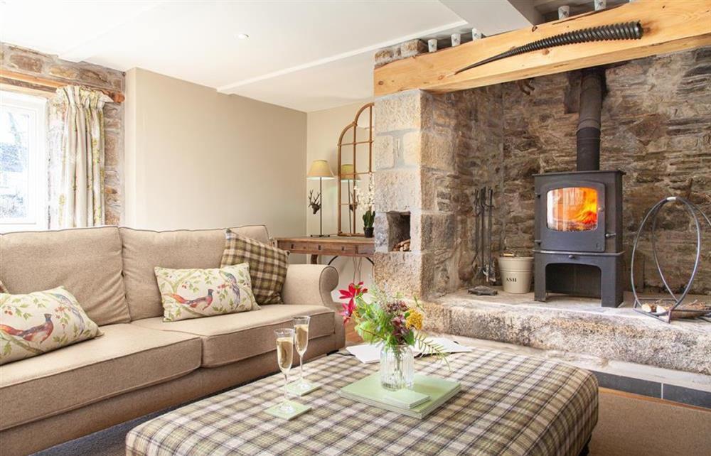 Large Sitting Room with wood burner at The Smithy in Cardinham