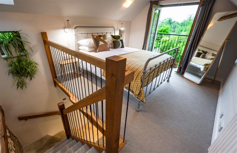 First floor: The bedroom with balcony at The Smokehouse, Ingoldisthorpe near Kings Lynn
