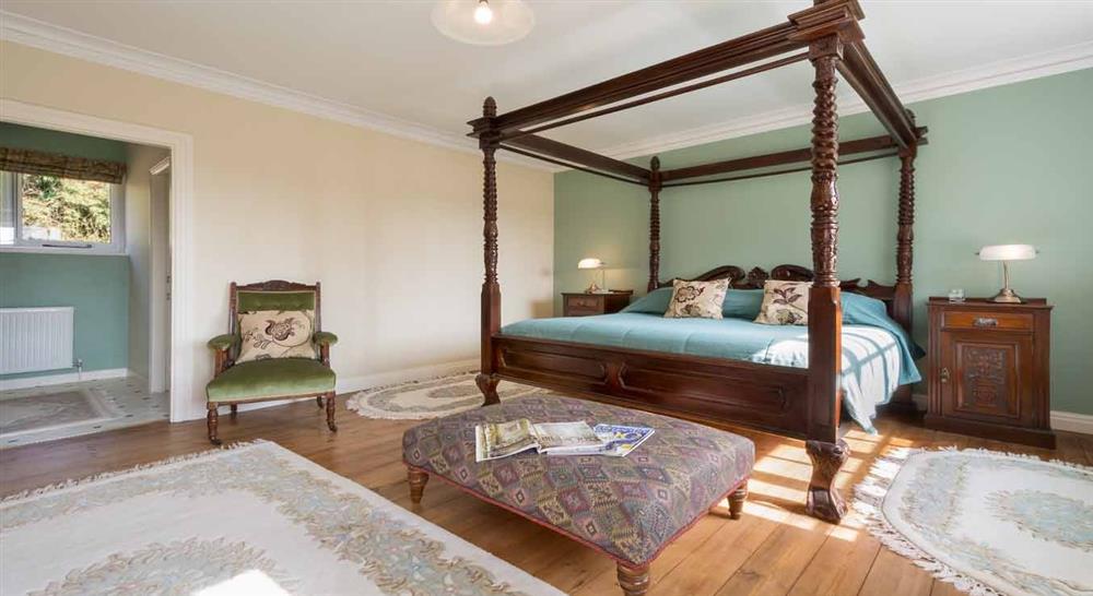 A grand four poster bed at The Squire's Retreat in Norwich, Norfolk