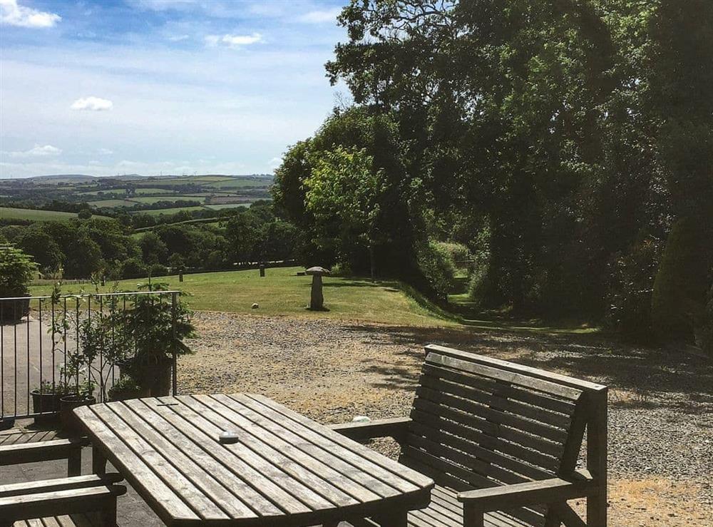 Relax and enjoy the scenery from the patio at The Stable in North Petherwin, near Launceston, Cornwall