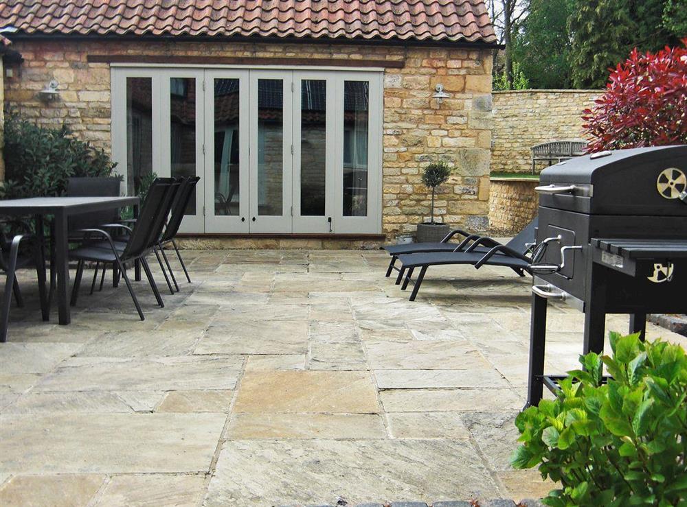 Secluded, enclosed courtyard with patio (photo 2) at The Stables in Aisby, near Grantham, Lincolnshire, England