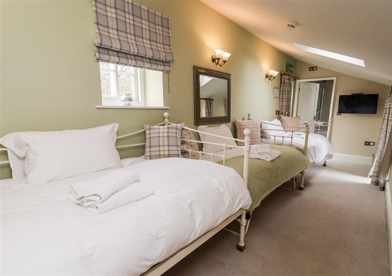 This is a bedroom at The Stables and West Wing, Bolton Percy near Tadcaster