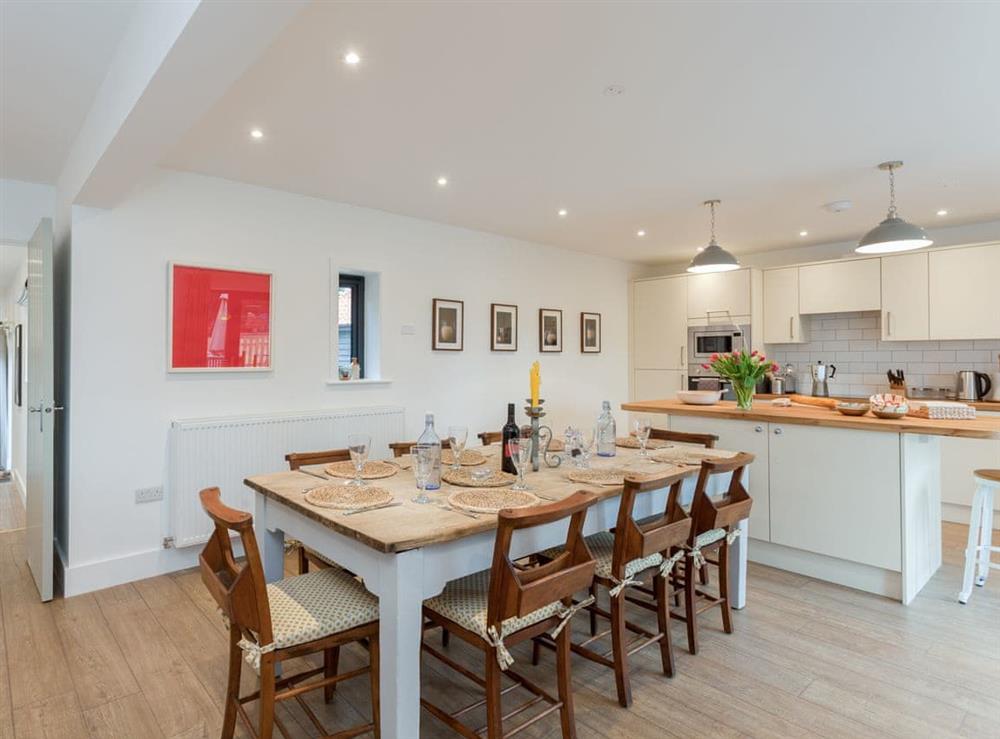 Contemporary dining area and kitchen at The Stables in Beauworth, near Alresford, Hampshire