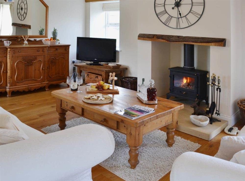 Spacious, beamed living room with multi-fuel burner and wooden floor at The Stables in Bolam, near Darlington, Durham