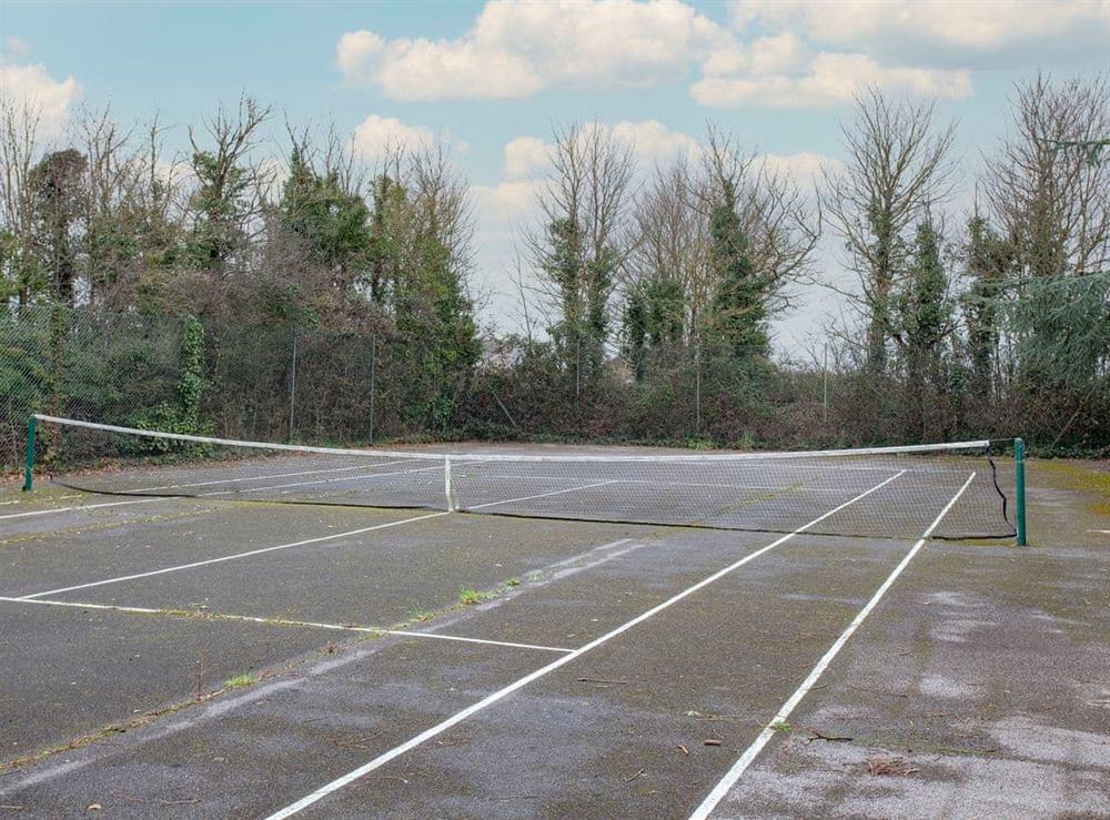Tennis court at The Stables in Clyst Honiton, near Exeter, Devon