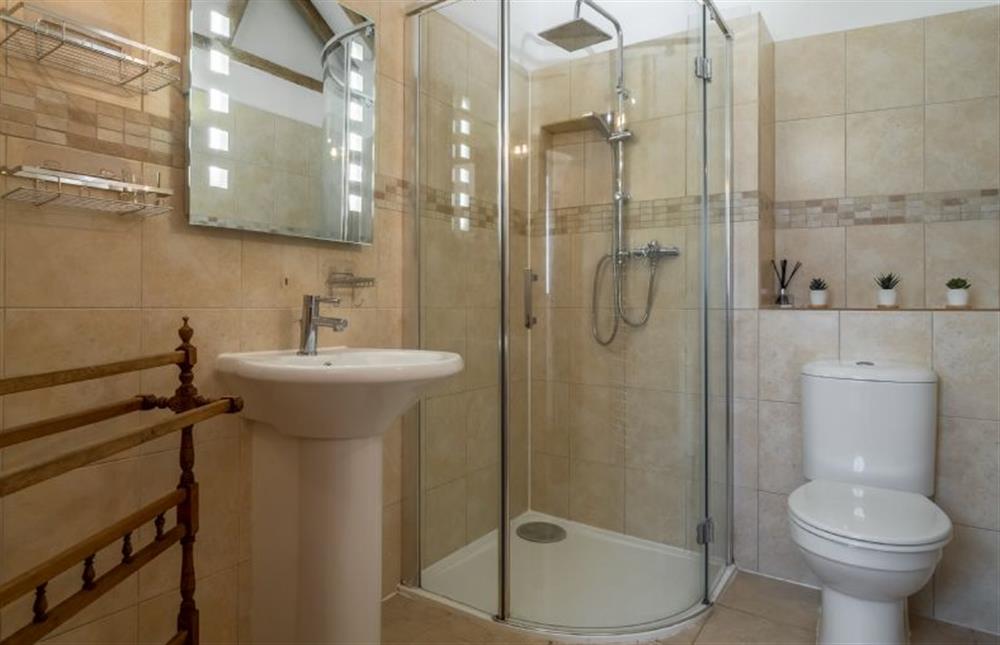 Shower room with WC and wash basin at The Stables, Edingthorpe near North Walsham