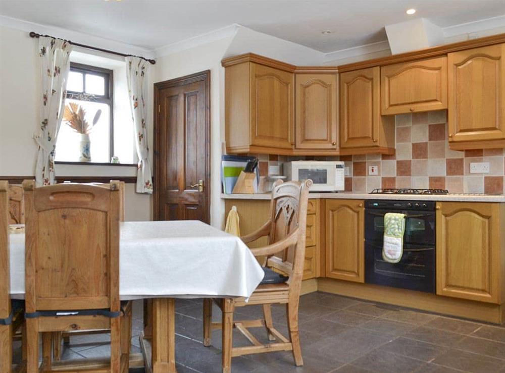 Well-equipped fitted kitchen with dining area at The Stables in Frosterley, near Bishop Auckland, Durham