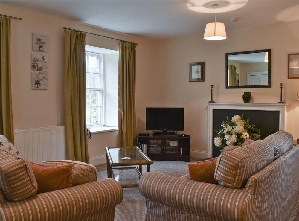 Comfortable living room with TV at The Stables in Harburn, near West Calder, West Lothian