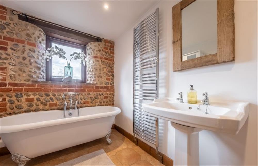 Family bathroom with roll-top bath at The Stables, High Kelling near Holt